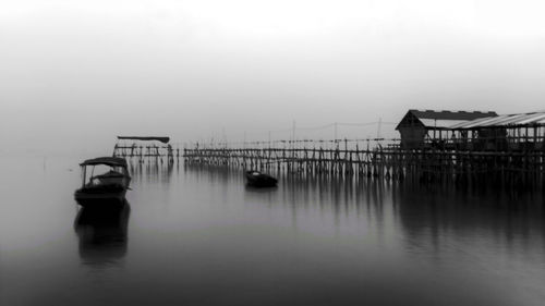 Pier over sea against sky