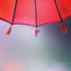 Low angle view of red balloons