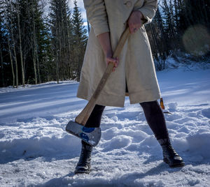 Person standing on snow covered landscape