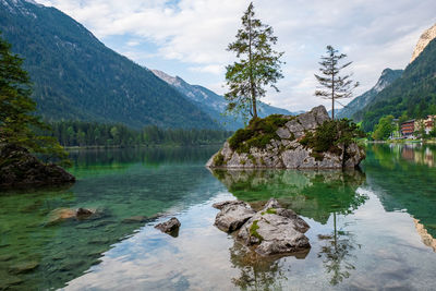 Scenic view of lake and mountains against sky