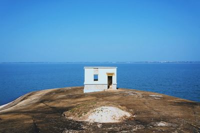 Scenic view of sea against clear blue sky