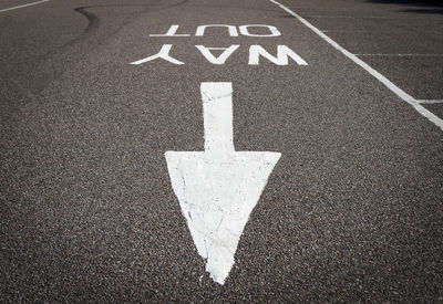 High angle view of arrow symbol on road