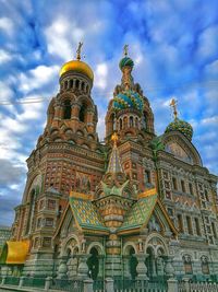 Low angle view of cathedral against cloudy sky