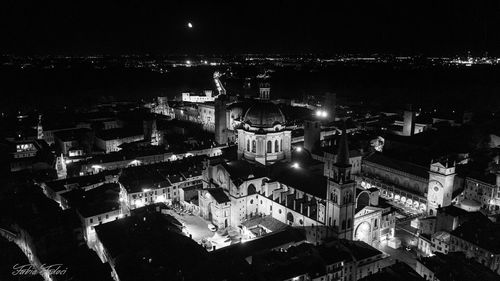 High angle view of illuminated buildings in city at night