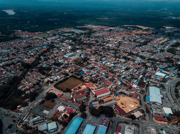 High angle view of illuminated buildings in city