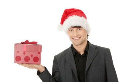 Portrait of a smiling young man against white background