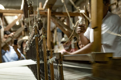 Man working  on a loom