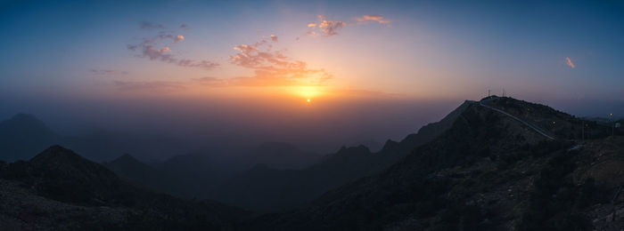 Scenic view of mountains against sky during sunset