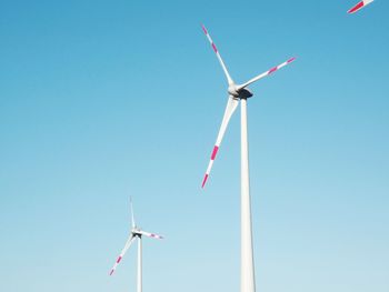 Low angle view of windmill against clear sky