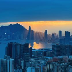 Cityscape against clear sky during sunset