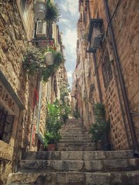 Steps amidst buildings in city