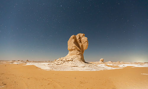 View of desert against clear sky