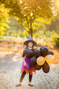 Full length portrait of girl wearing hat