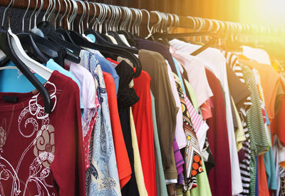 Clothes on rack at market stall