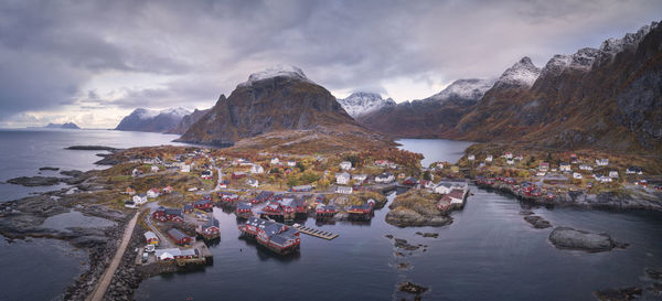 Panoramic view of sea and mountains against sky