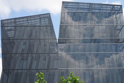 Low angle view of skyscraper against sky