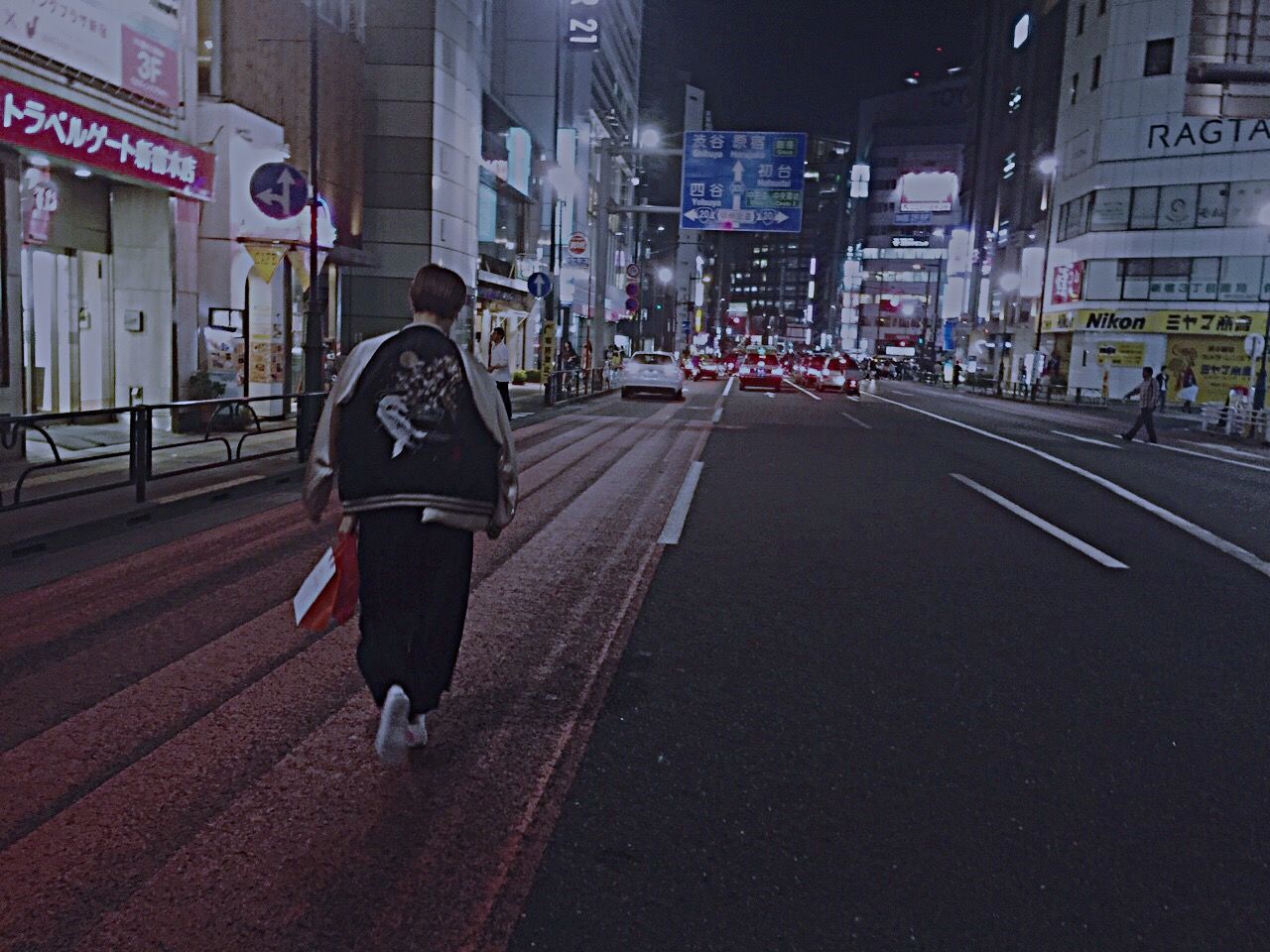 building exterior, city, street, architecture, built structure, walking, transportation, city life, rear view, road, men, full length, lifestyles, road marking, the way forward, person, city street, on the move