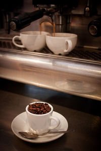 Close-up of coffee cup on table