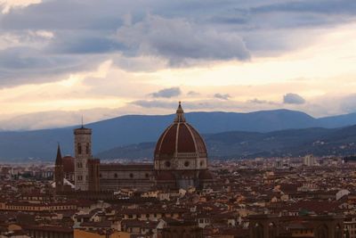 Duomo santa maria del fiore in city against cloudy sky during sunset