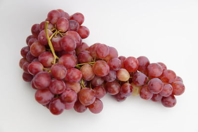 Close-up of grapes against white background