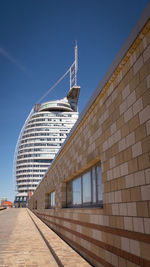 Low angle view of building against clear blue sky