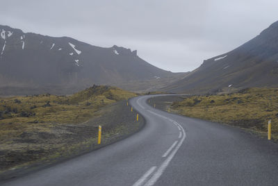 Road amidst landscape against sky