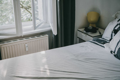 Close-up of curtain on bed at home