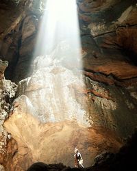 Woman standing on rock formation