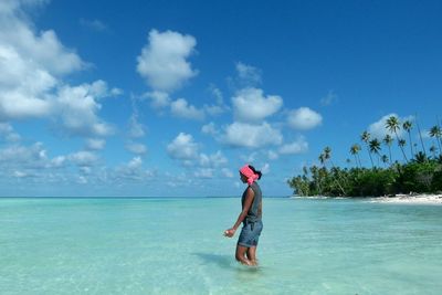 Woman standing on beach