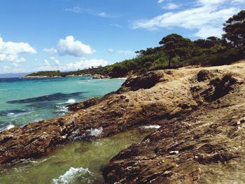 Scenic view of sea against cloudy sky