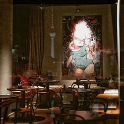 Close-up of table and chairs in window