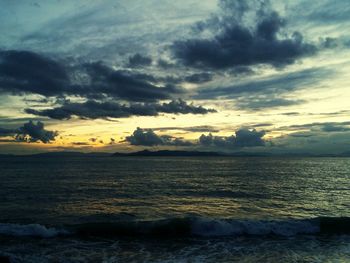 Scenic view of sea against cloudy sky