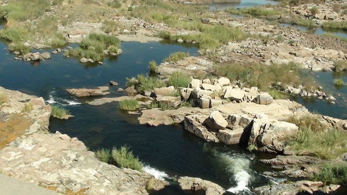 High angle view of lake and rocks