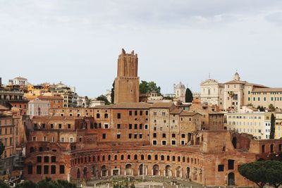 Buildings in city against sky