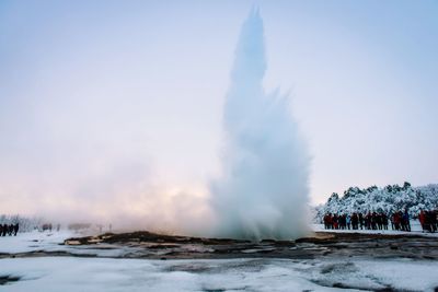 Panoramic view of clouds over water against clear sky