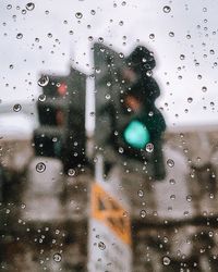 Full frame shot of wet glass window in rainy season