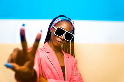 Portrait of young woman wearing sunglasses