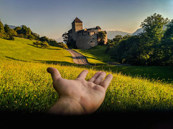Cropped image of woman standing on field