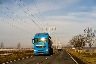 Cars on road against sky