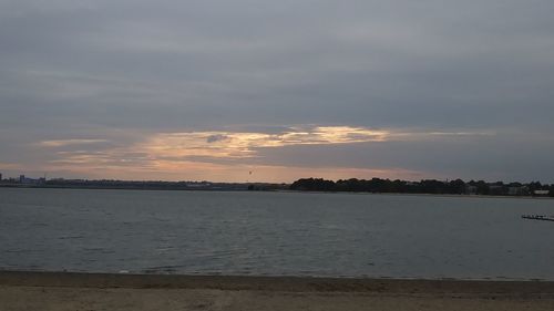 Scenic view of sea against sky at sunset