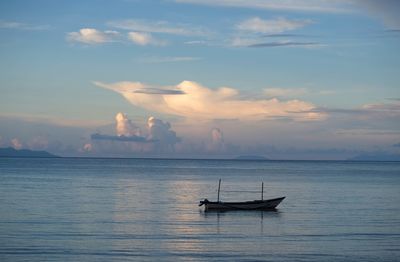 Boat in sea against sky during sunset at dili, timor leste.