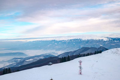 Sun over the winter mountains with snow, cindrel mountains, paltinis, romania