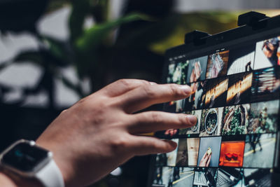 Midsection of person photographing with mobile phone