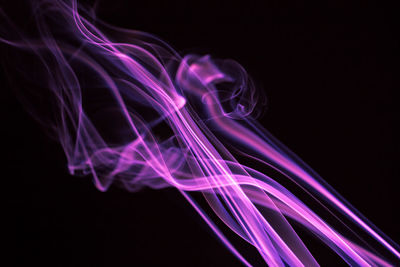 Close-up of smoke against black background