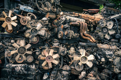 Stack of abandoned engines at junkyard