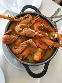 Directly above shot of cooked shrimps in cooking pan on table