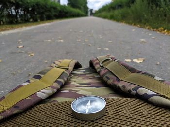 Close-up of shoes on road