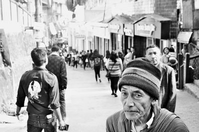 Portrait of senior man and mature man standing on street