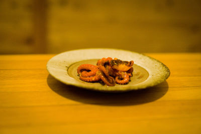 Close-up of fruit in plate on table