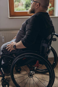 Side view of man with bicycle